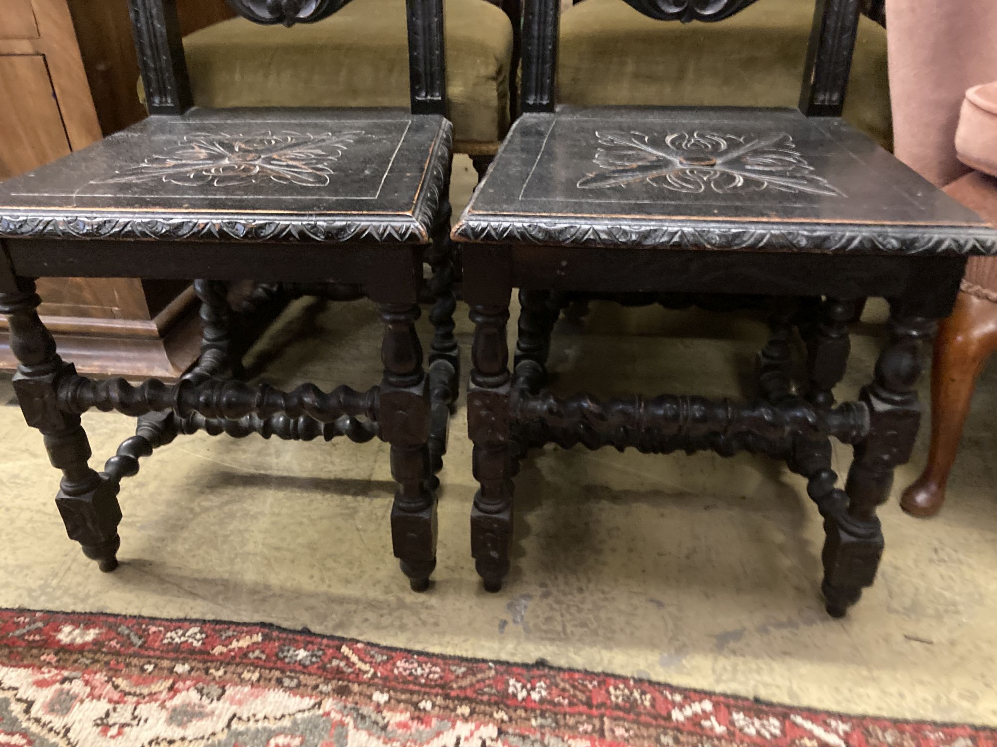 Two pairs of Victorian carved oak dining chairs